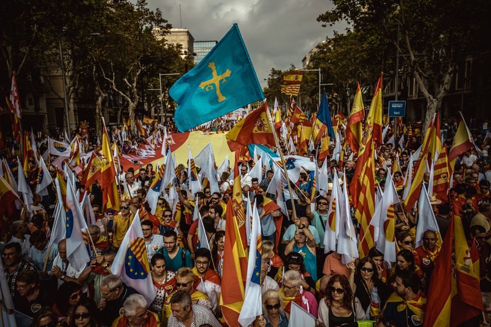 October 12th, 2017. Barcelona, Spain: Anti-separatist Catalans shout slogans as they march through the city of Barcelona as they protest for the indivisibility Spain's two days after a suspended independence declared by the pro-separatist Catalan Government