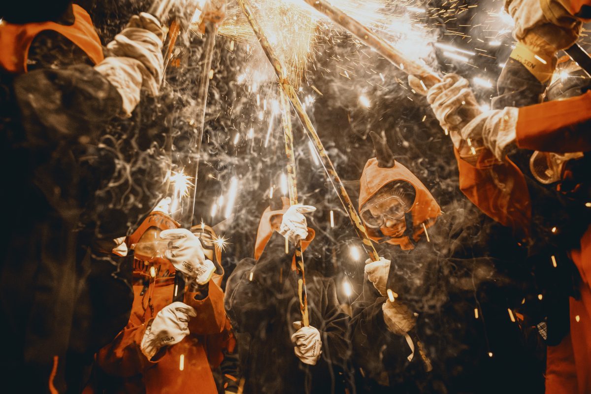 Little fire runners in devil costumes gather to enlighten their fireworks during the children 'correfocs' (fire-runs) at Barcelona's winter city festival 'Santa Eulalia' 2025