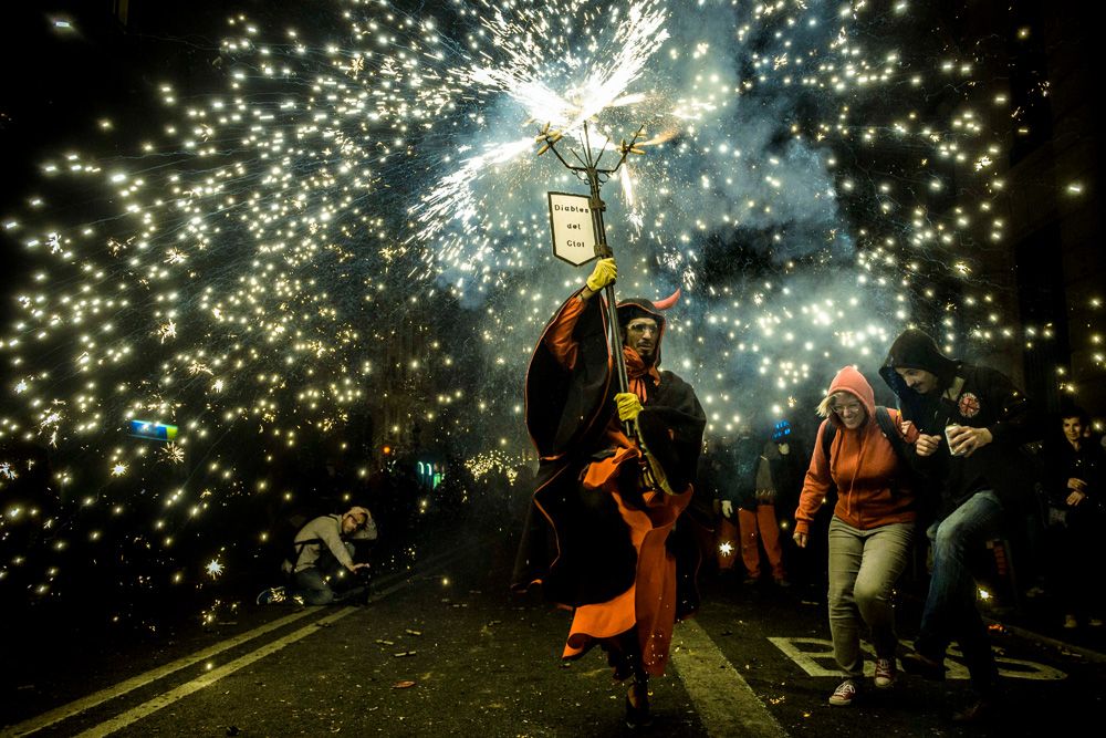 Barcelona, Spain. September 20th, 2015: Participants dressed in devil costumes set off their fireworks during the "Correfocs" run at the 2015 Merce festival in Barcelona.