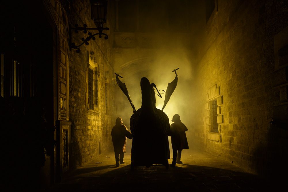 Barcelona, Spain. 11 February, 2017: A fire beast sets off its fireworks while it is carried through Barcelona's gothic quarter during the 'correfocs' (fire-runs) at the city's winter festival 'Santa Eulalia' 2017