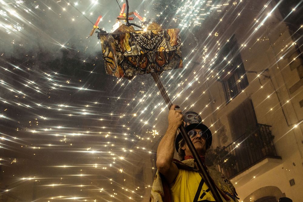 September 17th, 2016. Sitges, Spain: A member of 'Diables de Sitges - colla jove' sets off his fireworks during Sitges' little 'Festa Major', 'Santa Tecla'