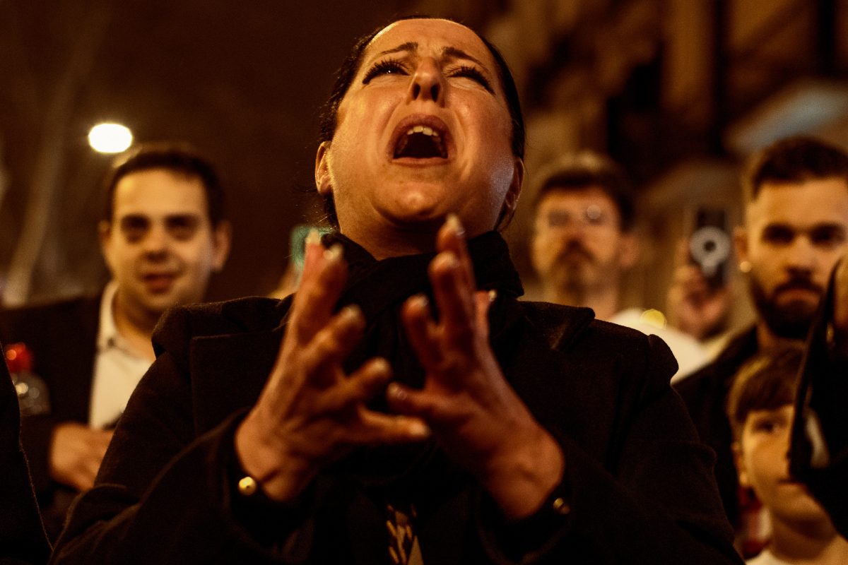 A 'Saeteras' (saeta singer) sings a 'saeta' (very emotional religious song) during the Palm Sunday procession in Barcelona