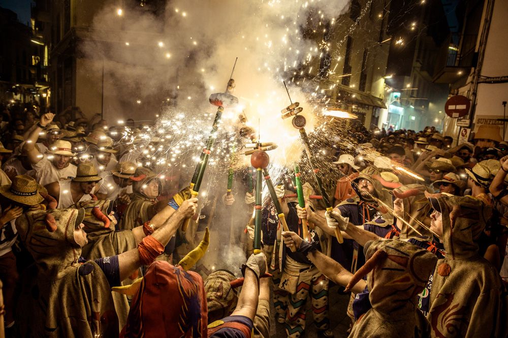 August 23rd, 2016. Sitges, Spain: Members of 'Diables de Sitges - Colla Vella' gather to enlighten their fireworks during the 'Festa Major de Sitges'.