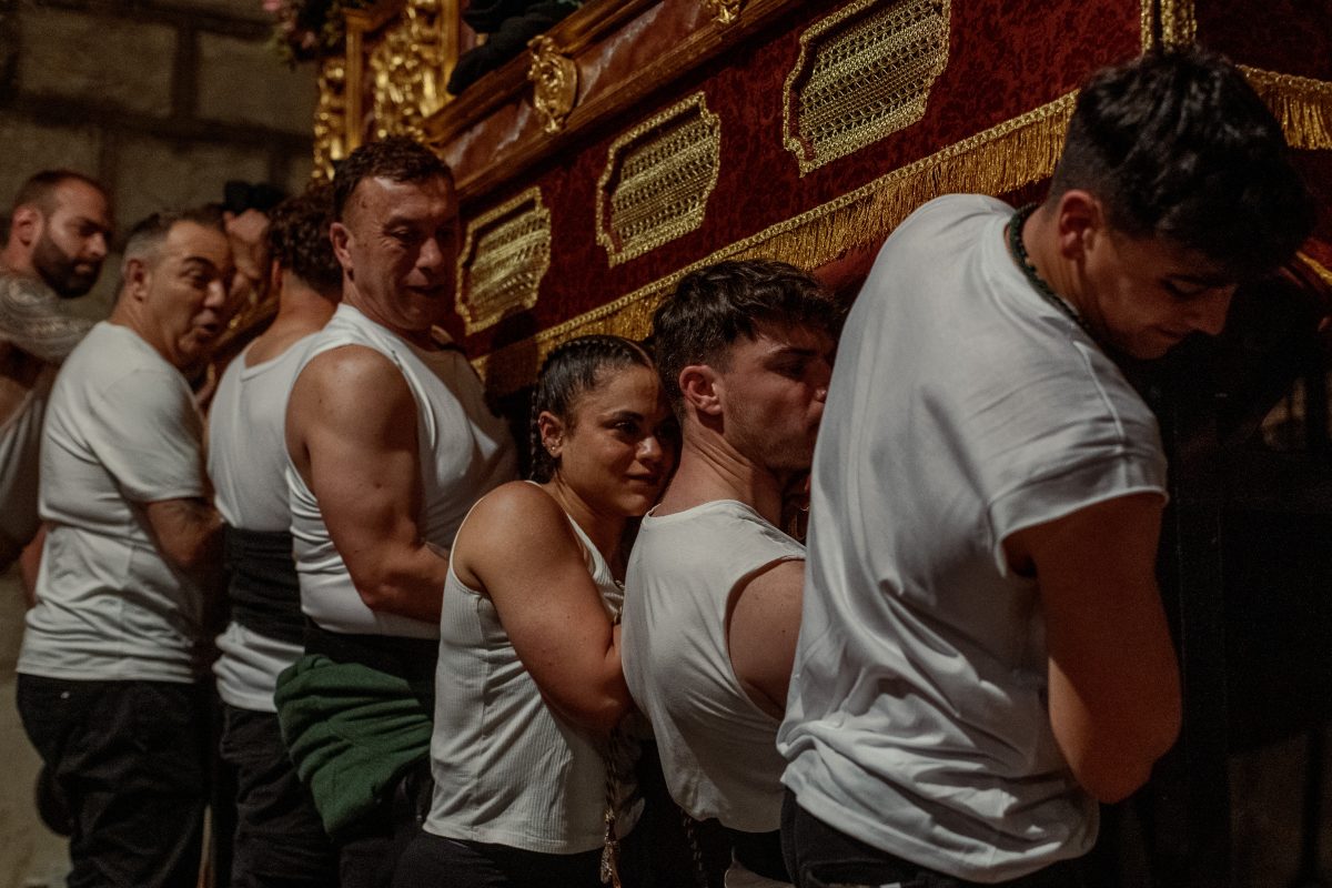 'Costaleros' (porter) of the 'Nuestra Senora de las Angustias' brotherhood carry their float to its place in Barcelona's St Jaume church at the end of the Good Friday procession