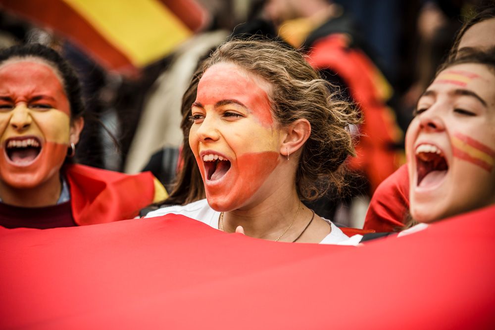 Barcelona, Spain. 12th October, 2016: Girls with Spanish colors painted on their face shout slogans during the celebration of Spain's National Day in Barcelona