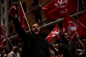 Communists demonstrate for the working class marching through Barcelona at labor day.