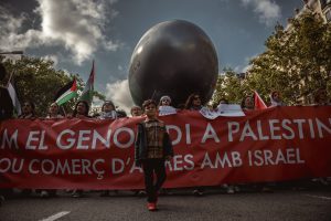 Barcelona, Spain. 20 April, 2024: Demonstrators against Israel's ongoing attacks on the Gaza Strip, which have led to numerous deaths among the civilian population, carry a giant bomb in protest against the arms trade with Israel. Israel is reacting to an attack by the Islamist organization Hamas on 7 October.