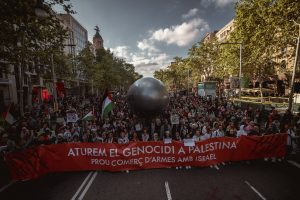 Barcelona, Spain. 20 April, 2024: Demonstrators against Israel's ongoing attacks on the Gaza Strip, which have led to numerous deaths among the civilian population, carry a giant bomb in protest against the arms trade with Israel. Israel is reacting to an attack by the Islamist organization Hamas on 7 October.
