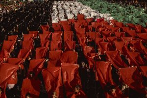 Barcelona, Spain. 20 April, 2024: Protesters against Israel's ongoing attacks on the Gaza Strip, which have led to numerous civilian deaths, form a large human mosaic representing the Palestinian flag. Israles attacks are a reacting to an attack by the Islamist organization Hamas on 7 October.