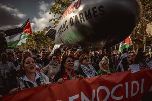 Barcelona, Spain. 20 April, 2024: 
Demonstrators against Israel's ongoing attacks on the Gaza Strip, which have led to numerous deaths among the civilian population, carry a giant bomb in protest against the arms trade with Israel. Israel is reacting to an attack by the Islamist organization Hamas on 7 October.