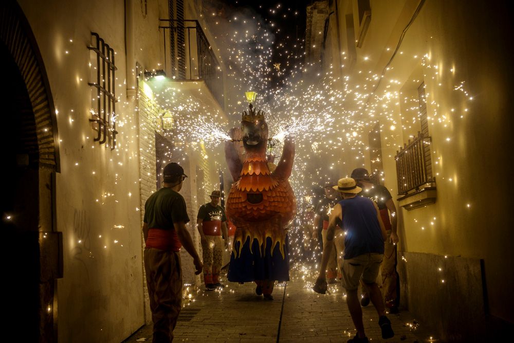 Sitges, Spain. 23 August, 2015: The 'Aliga (Eagle) de Sitges', a folkloric symbol, sets off his fireworks among the crowd of spectators at the 'Festa Major de Sitges'.