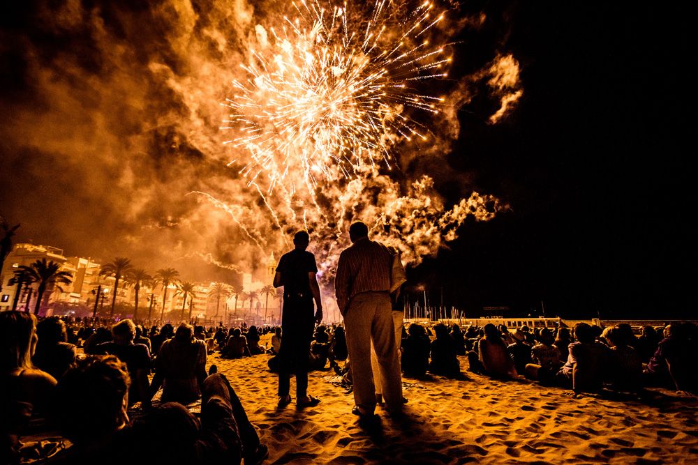 Sitges, Spain. 22 September, 2016: Thousands follow the traditional display of fireworks at the 'San Bartolome' church taking place during the 'Santa Tacla Festival' in Sitges.