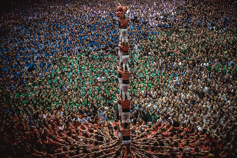 The 'Colla Joves Xiquets de Valls' build a human tower during day three of the 27th Tarragona Human Tower Competition in Tarragona. The competition takes place every other year and features the main 'Castellers' teams (colles) of Catalonia during a three day event organized by the Tarragona City Hall