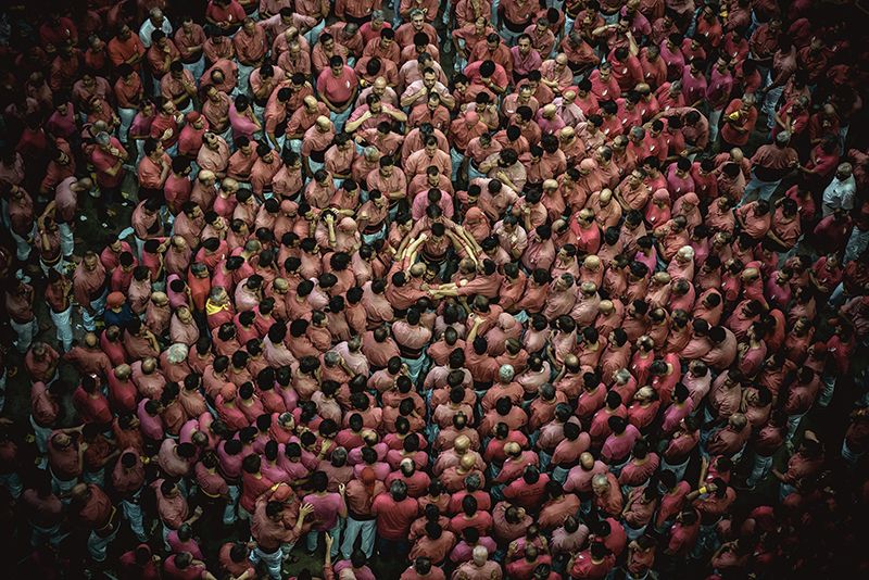The 'Colla Vella dels Xiquets de Valls' gather to form the base of a human tower during day three of the 27th Tarragona Human Tower Competition in Tarragona. The competition takes place every other year and features the main 'Castellers' teams (colles) of Catalonia during a three day event organized by the Tarragona City Hall