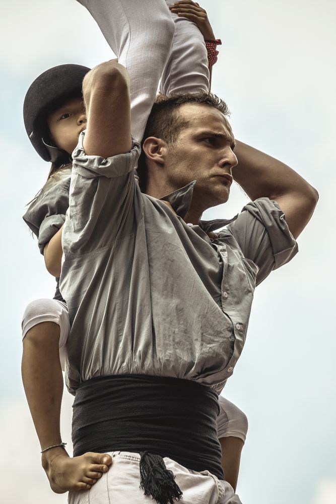 Barcelona, Spain. 24 September, 2014: The 'Castellers de Sants' build a human tower during the city festival 'La Merce 2014' in front of the town hall of Barcelona