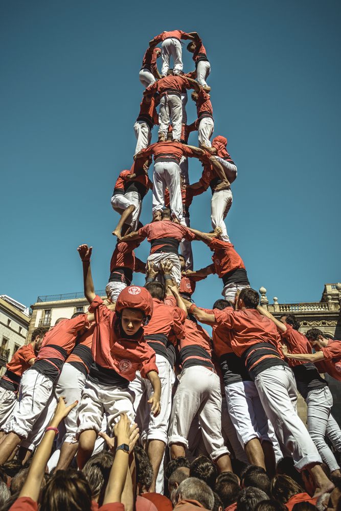 Barcelona, Spain. 20 September, 2015: The 'Colla Jove Xiquets de Valls' deconstract one of their human towers during the city festival 'La Merce 2015' in front of the town hall of Barcelona.