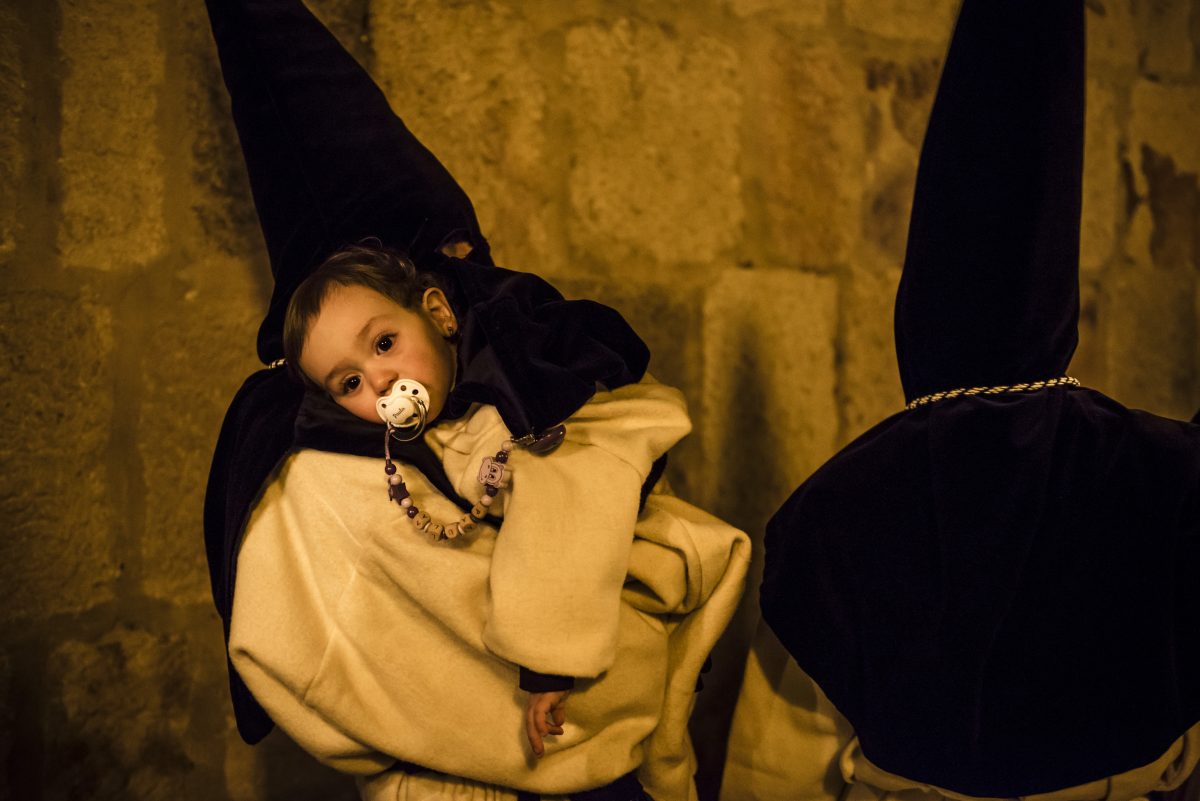 Penitents hold torches while they walk the streets during the Good Friday procession of the 'Nuestra Madre de las Angustias' brotherhood in Zamora